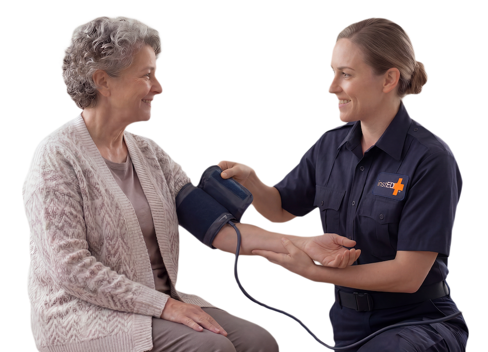 insted worker taking blood pressure from an elderly woman