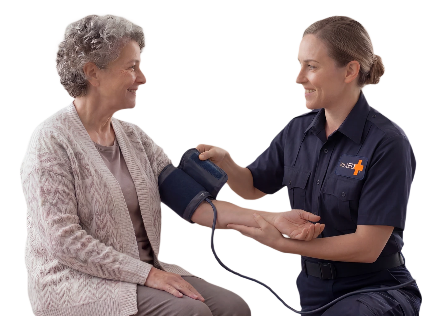 insted worker taking blood pressure from an elderly woman